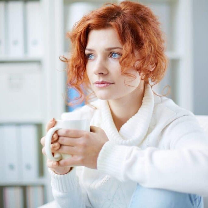 anxiety-PQ3YGPB-scaled Anxious woman holding coffee